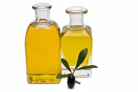 Two square bottles of oil. Stock Photos