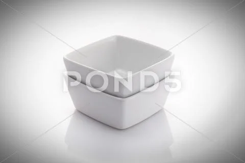 Two square china bowls isolated on a white background Stock Photos