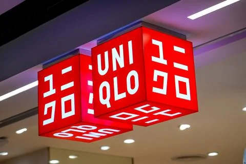 Two square cube decoration sign and logo of a Uniqlo store, a commercial br.. Stock-Fotos