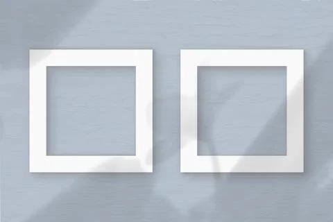 Two square frames sheet of white textured paper on the grey wall background. 스톡 일러스트