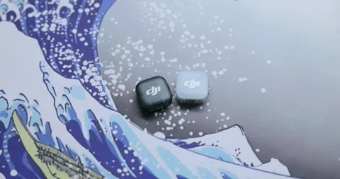 Two Square Wireless Microphone Transmitters On Wave Pattern Mousepad Stock Footage 348894260