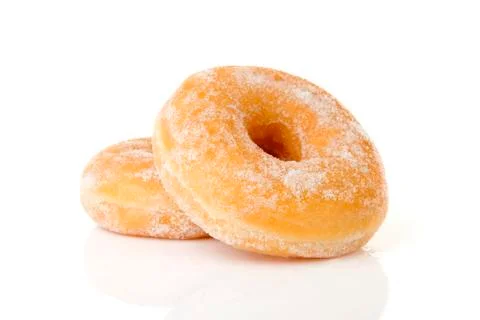 Two stacked sugared donuts over white background Stock Photos