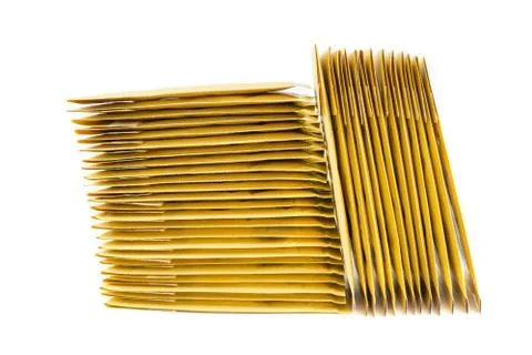 Two stacks of bubble padded envelopes slightly shifted to the left. Stock Photos