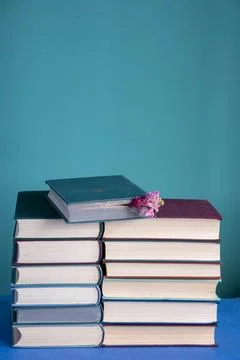 Two stacks of second-hand books in multi-colored hard bindings. Textured, t.. Fotos Stock