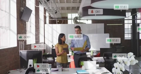 Two staff reviewing tablet and folder, creating likes, shares, sliding pink UI Stock Footage 331349937