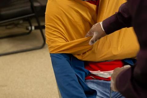 Two staff training to give first aid to arm with broken bones Stock Photos