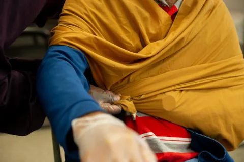 Two staff training to give first aid to arm with broken bones Stock Photos