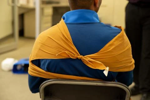 Two staff training to give first aid to arm with broken bones Stock Photos