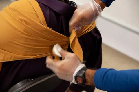 Two staff training to give first aid to arm with broken bones Stock Photos