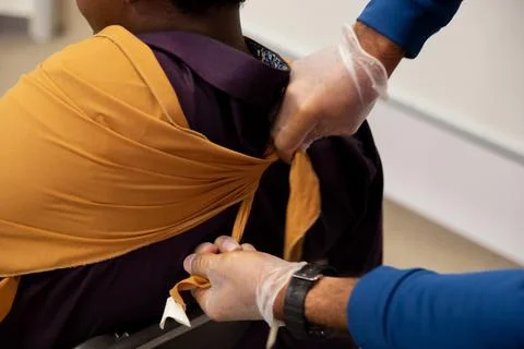 Two staff training to give first aid to arm with broken bones Stock Photos