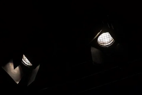 Two stage spot lights in dark background Stock Photos