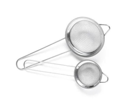 Two stainless steel kitchen strainers with fine mesh and long handles, essent Stock Photos