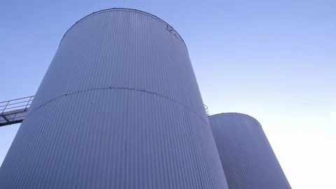 Two Stainless Steel Liquid Storage Tanks against the sky Video stock 77235846