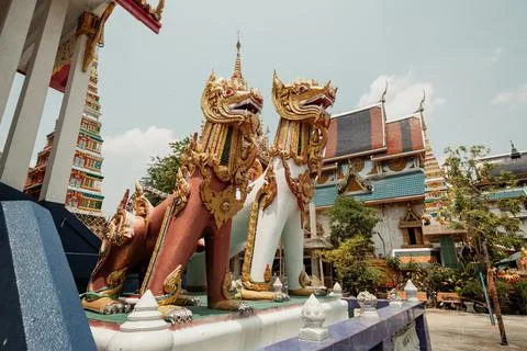 Two statues of animals with demonic faces, Bangkok, Thailand Stock Photos