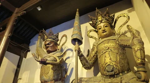 Two statues in a Buddhist temple Stock Footage 44421728