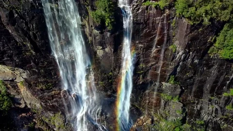 Two steep waterfalls with a slight rainbow Stock Footage 239551774
