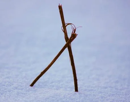 Two sticks in the snow Stock Photos