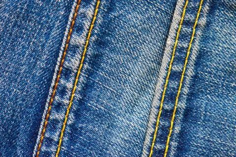 Two stitches on jeans Stock Photos