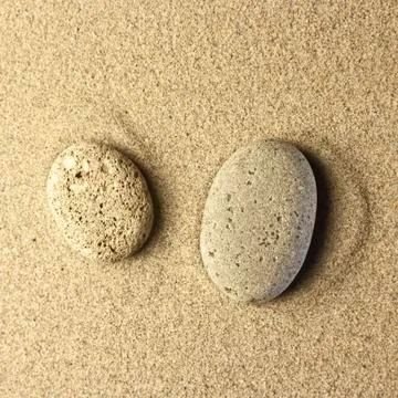 Two stones in the sand Stock Photos