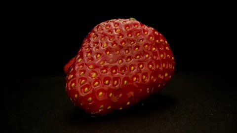 Two Strawberries On Black Background Stock Footage 131800533