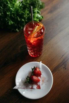 Two Strawberries on a Plate With Drink Stock Photos