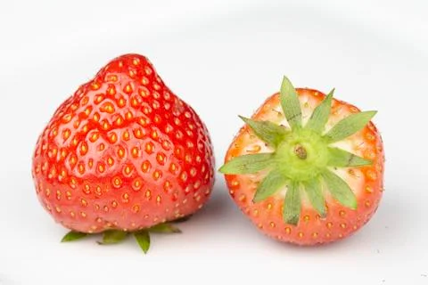 Two strawberries on a plate Stock Photos