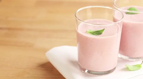Two strawberry milkshakes Stock Footage 24657809