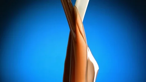 Two stream of milk and chocolate meet Video stock 81805623