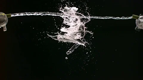 Two Streams of Water Collide Stock Footage 76993228