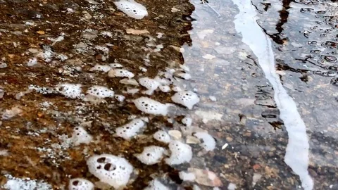 Two Streams of Water Merging in Storm Drain Stockbeeldmateriaal 79330207