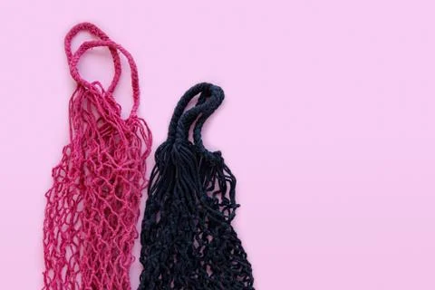 Two string bags on a pink background. zero waste concept Stock Photos