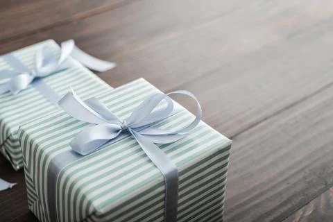 Two striped gift box with blue ribbon Stock Photos