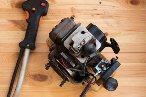 Two stroke lawn trimmer engine partly disassembled Stock Photos