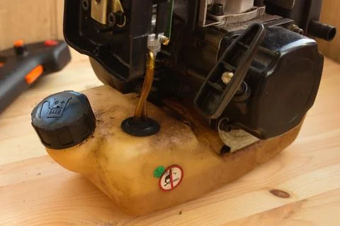 Two stroke lawn trimmer engine partly disassembled Stock Photos
