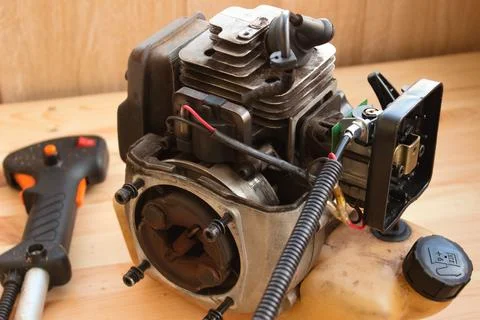 Two stroke lawn trimmer engine partly disassembled Stock Photos