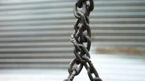 Two strong chains against a metal sheathing background Stock Footage 137880912