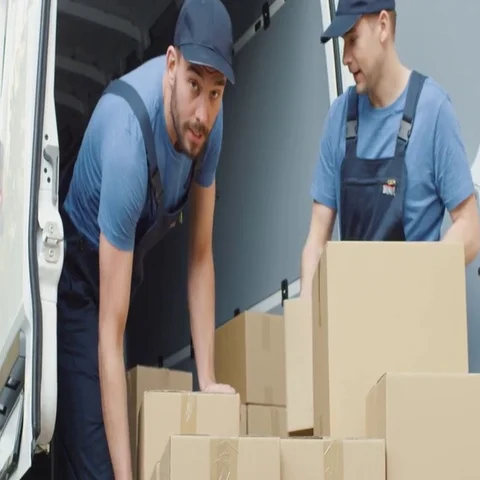 Two Strong Delivery Men Loading Commercial Vehicle Full of Cardboard Boxes in Sl 스톡 동영상 69721282