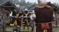 Two strong men wearing armour reenacting duel between brave medieval knights HD Footage