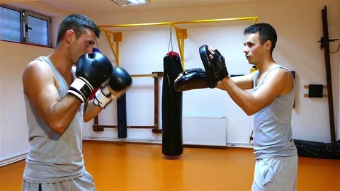 Two strong young boxers doing boxing exercises in the gym. Stock Footage 83994625
