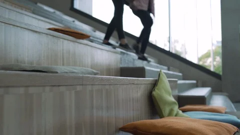 Two student girls climbing down stairs in school Video stock 104076284