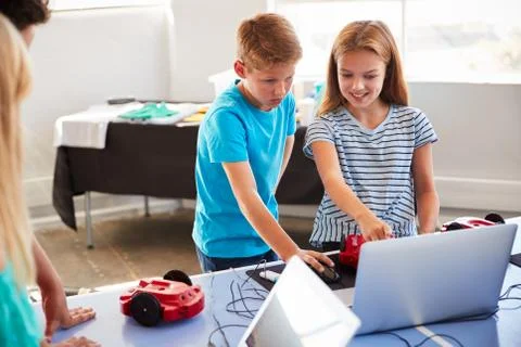 Two Students In After School Computer Coding Class Learning To Program Robot Stock Photos