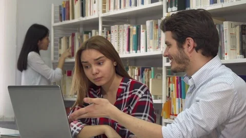 Two students argue about something on laptop Stock Footage 74285458