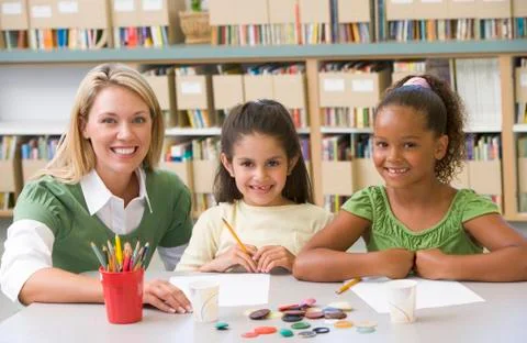 Two students in art class with teacher Stock Photos