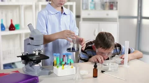 Two students in chemistry class Stock Footage