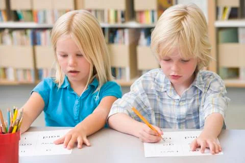 Two students in class learning letters Foto stock
