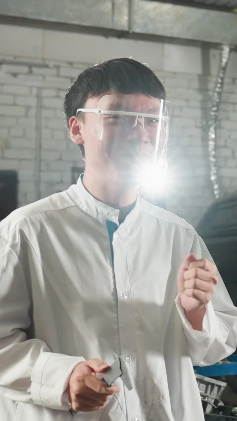 Two Students Dancing in Lab Coats with Protective Glasses in Mechanical Workshop Stock Footage 318199681