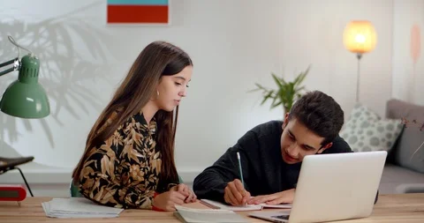 Two students intense gesticulate while solving math exercises at light living Stock Footage 120946280