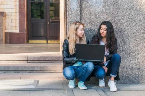 Two students with a laptop Stock Photos