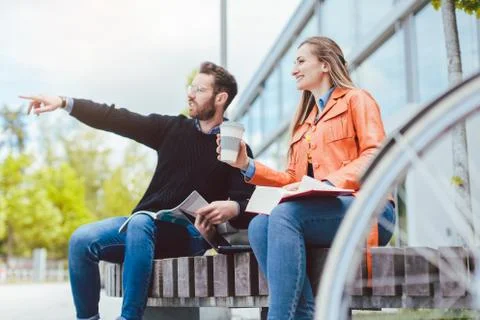 Two students looking around campus in university Stock Photos