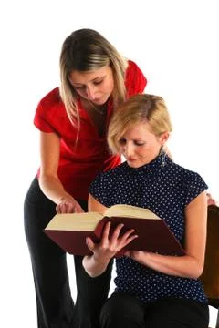 Two students reading and studying school book Stock Photos